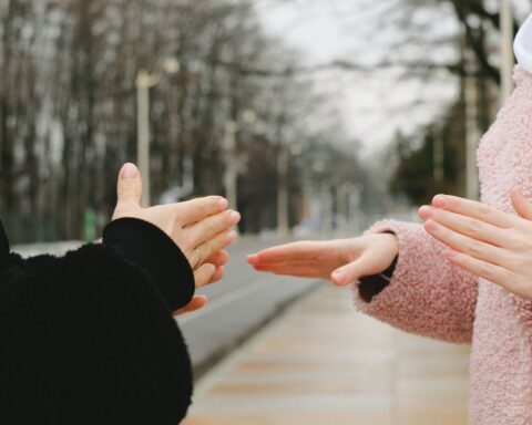 crop deaf mute people talking in winter park